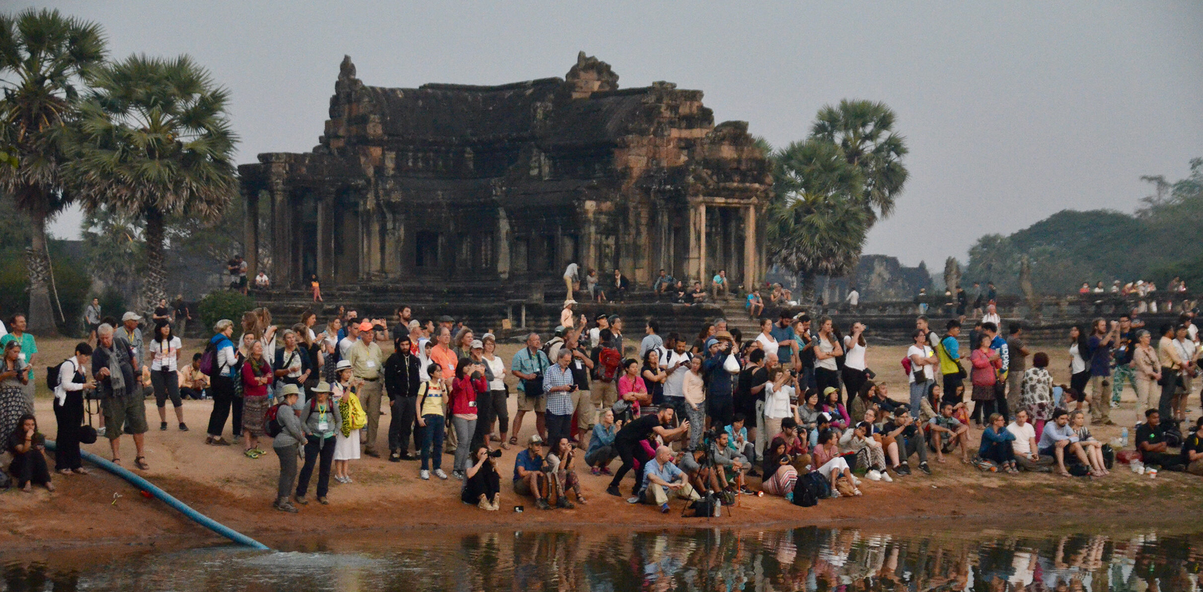 Crowd awaiting sunrise at Ankor Wat, Cambodia